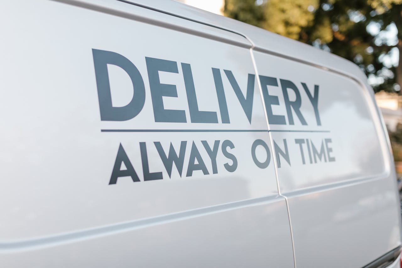 services-04 Close-up of delivery van with slogan 'Always On Time' emphasizing timely service.